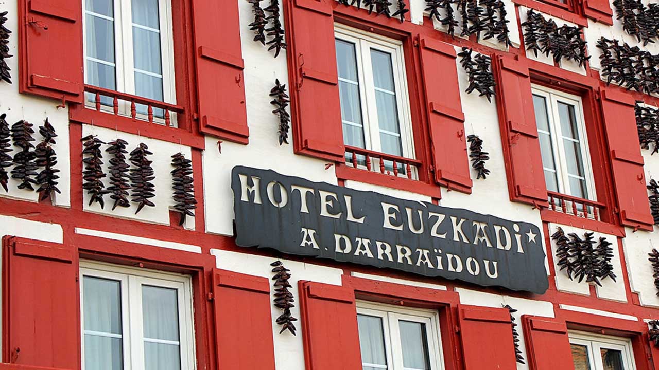 A house in Espelette decorated with bright red chili peppers